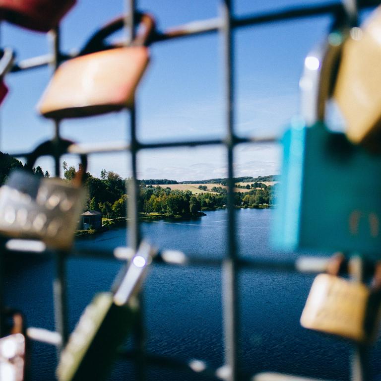 Padlocks attached to a bridge