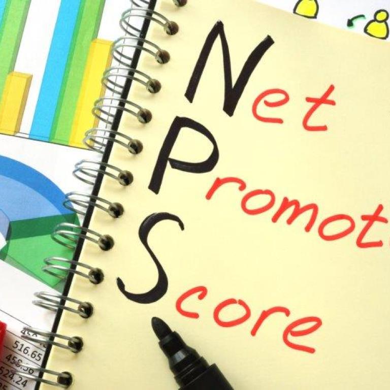 Notebook with Net Promoter Score written in it